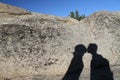 Wide angle shot of the shadow of a kissing couple