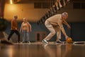 Senior Man Playing Bowling Side View Royalty Free Stock Photo