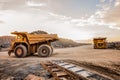 Wide angle of two Large Mining Dump Trucks for transporting ore rocks Royalty Free Stock Photo