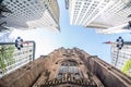 Wide angle upward view of Trinity Church at Broadway and Wall Street with surrounding skyscrapers, Lower Manhattan, New