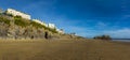 A wide-angle view along the South Beach of the cliffs and Saint Catherine`s Island in Tenby, Pembrokeshire Royalty Free Stock Photo