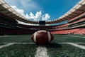 Wide angle view American football stadium with ball on ground photo, portraying sports venue