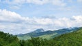 Wide angle view of big mountain with blue sky and white clouds Royalty Free Stock Photo