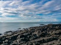 Wide-angle view of blue sky white sand beach in clear air sunny day. a white seagull fly through the clear blue sky. tourism in Royalty Free Stock Photo