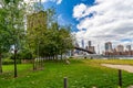 Wide angle view Brooklyn Bridge with lower Manhattan skyline, One World Trade Center Empire Fulton Ferry Park