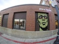 Wide angle view building with scary face mural