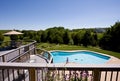 Wide angle view of deck and swimming pool