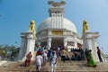 Wide angle view of dhauli temple with visitors