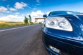 Wide angle view, dirty japanese car headlight on focus
