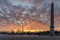 Wide angle view of Egyptian Luxor Obelisk Pillar with hieroglyphics in silhouette at the centre of Place de la Concorde in Paris Royalty Free Stock Photo