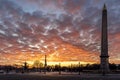 Wide angle view of Egyptian Luxor Obelisk Pillar with hieroglyphics in silhouette at the centre of Place de la Concorde in Paris Royalty Free Stock Photo