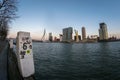 Ultra wide angle view of Erasmus bridge and skyline of Rotterdam on a clear winter day.