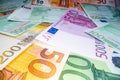 Wide angle view of euro notes background stacked on top of each other. Euro money banknotes, pile of money, cash, stack of bills. Royalty Free Stock Photo