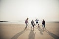 Playing Football at the Beach Royalty Free Stock Photo