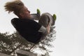 Wide angle view - flip parkour jumping in winter snow park - free-run training