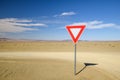 Wide angle view of a give way yield sign at a gravel road intersection in the Namibian Desert between Ai-Ais Fish River Canyon a