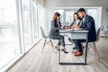 Wide angle view of group business people in bright spacious modern office near panoramic windows