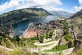 Wide angle view of the Kotor Gulf or Boka Kotorska with medieval town  sea port with ferryboats and surrounding mountains. Royalty Free Stock Photo