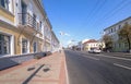 A wide angle view of a long street.