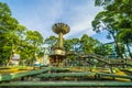 Wide angle view of Lotus pillar - An iconic architecture at Turtle lake (Ho Con Rua) with blue sky in Saigon