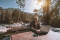 Old hunter with his laptop in mountains Royalty Free Stock Photo