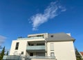 Wide angle view of modern apartment building with clear blue sky in background Royalty Free Stock Photo