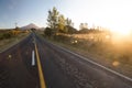 Wide angle view on Mount Taranaki Mount Egmont in New Zealand with road leading to it Royalty Free Stock Photo