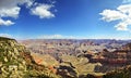 Wide angle view overlooking the vastness of the Grand Canyon with deep blue sky above Royalty Free Stock Photo