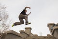 Wide angle view - parkour jumping in winter snow park - free-run training