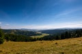 Wide angle view from the top of the mountain, green valley on a late summer day in Transylvania Royalty Free Stock Photo