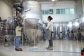 Young People Cleaning Workshop at Factory Royalty Free Stock Photo