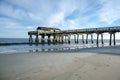 Wide angle view of the Tybee Island Pier in Georgia. Extra copyspace in the sand Royalty Free Stock Photo