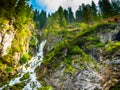 Wide angle view of the Vallesinella waterfall in the forest