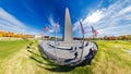 Wide-Angle View of the Washington Monument with Flags and Visitors Royalty Free Stock Photo
