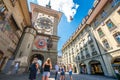 Wide angle view of Zeitglockenturm or Zytglogge clock tower with tourists looking at it in Bern old town Switzerland