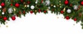 Wide arch-shaped Christmas border on a white background, crafted from fresh fir branches and adorned with red and silver ornaments