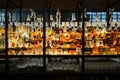 Wide Array of Liquors on Illuminated Shelves at Time Out Market in Lisbon, Portugal