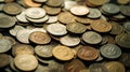 Wide array of various coins scattered randomly on a surface