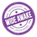 WIDE AWAKE text on violet indigo round grungy stamp Royalty Free Stock Photo