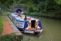 Wide beam narrowboat waiting to enter canal tunnel