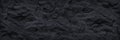 Wide black grunge banner. Dark gray stone background. Black rock texture.