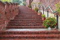 Wide brick stairs decorated with flowers