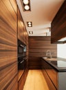 Wide brown kitchen in modern apartment