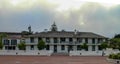 Wide building with staircase leading to entrance