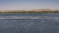 The wide and calm Nile River. Ripples on the blue water.