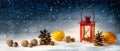 Wide christmas decoration background with a red candle light lan