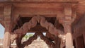 wide clip walking towards the treasury building at fatephur sikri