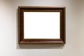 Wide dark brown wooden picture frame on gray wall