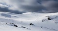 Vast Snow- Covered Landscape with Dark Clouds and Rocky Outcrops winter nature Royalty Free Stock Photo