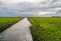 Wide ditch in a Dutch polder landscape